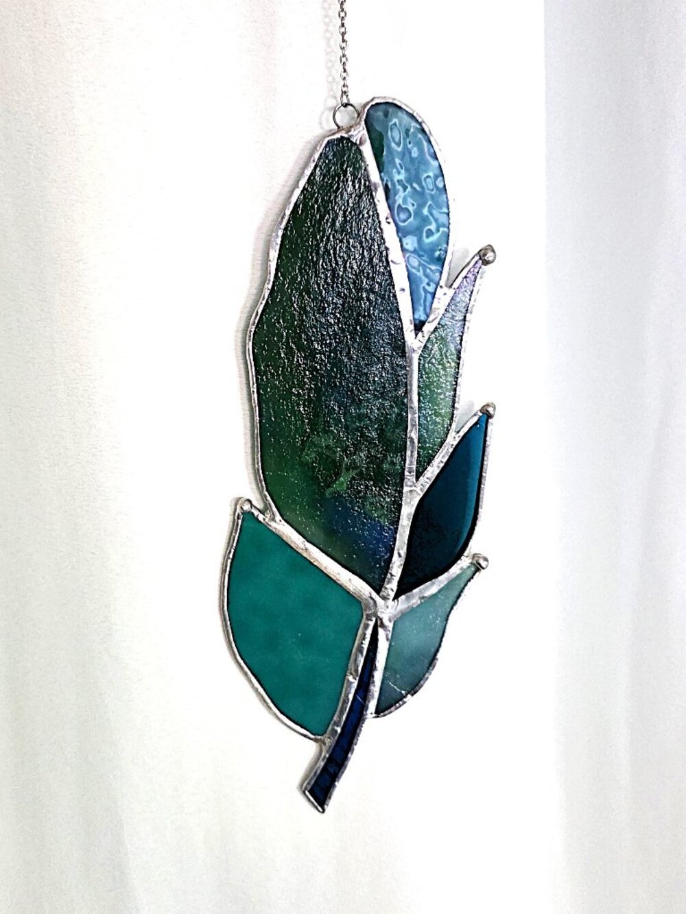Blue teal stained glass feather suncatcher